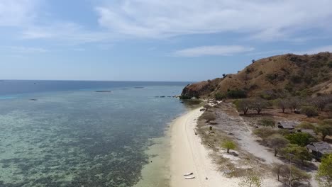 Aerial-view-paradise-beach-and-coral-reef-on-Kanawa-Island,-Labuan-Bajo,-Indonesia