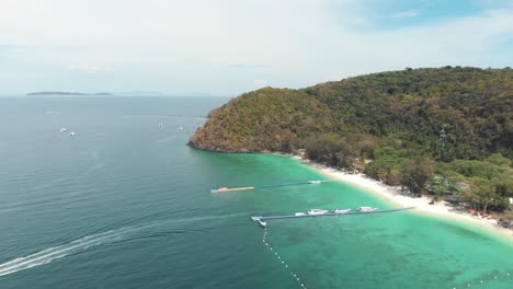Speed-Boat-leaving-to-Thailand-main-land-from-Banana-Beach-Bay-in-Koh-Hey---Aerial-wide-high-Panoramic-shot