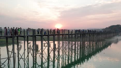 Aerial-of-famous-wooden-U-Bein-Bridge-with-red-sunset-in-Myanmar