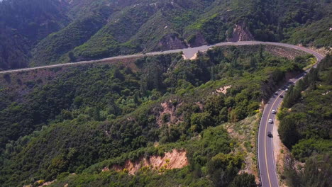 Stunning-aerial-view-of-a-winding-mountainside-road