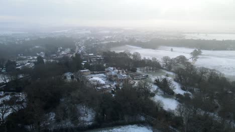 Birch-hall-Large-mansion-house-winter-Theydon-Bois-,-Essex-UK-,-background-misty-sky-aerial