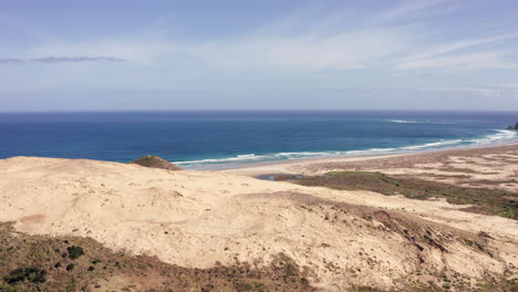 Giant-Sand-Dunes-With-Blue-Sea-And-Beach-In-Summer-At-Cape-Reinga,-Aupouri-Peninsula-At-North-Island-Of-New-Zealand