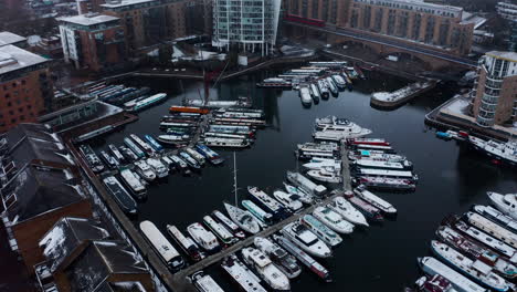 Drone-shot-over-Limehouse-waterside-and-marina-boats-in-the-snow-London