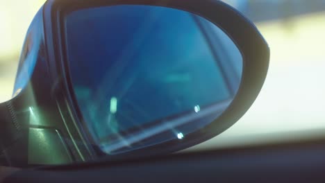 Driving-car,-rear-view-mirror-detail