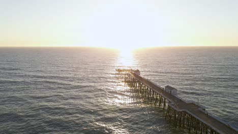 Sunset-over-San-Clemente-Pier-on-California-coast,-USA,-aerial-view