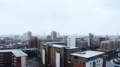 Rising-drone-shot-of-heavy-snow-in-Limehouse-London