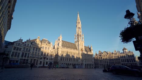 Grand-Place-Brussels,-Belgium,-wide-dolly-truck-shot-sideways-with-town-hall-in-the-center