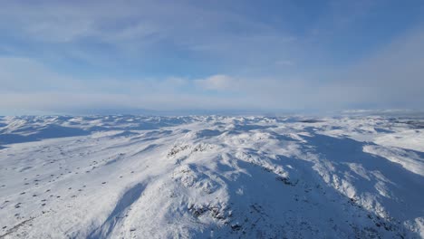 Closing-up-drone-footage-of-beautiful-landscape-of-Hardangervidda-national-park-in-winter