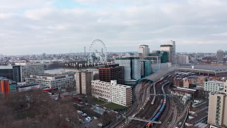 Slow-dolly-forward-drone-shot-towards-London-eye-over-Waterloo-train-station
