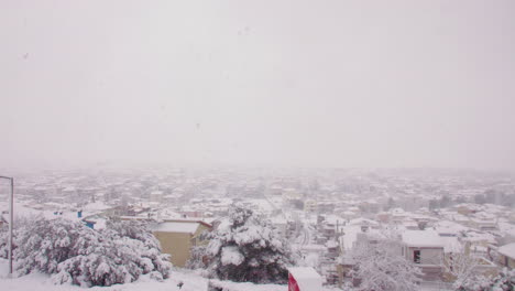 Rare-bad-weather-Medea-blanket-snow-cover-over-Greek-neighbourhood-rooftops-city-landscape