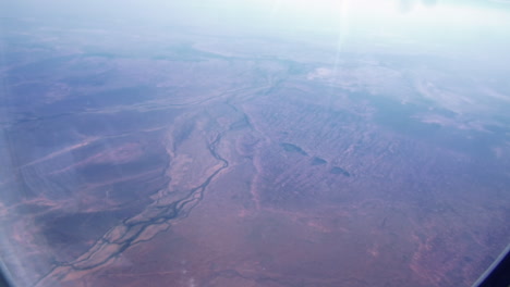 Landscape-From-The-Airplane-Window-Flying-From-Australia-To-Singapore---aerial,-POV