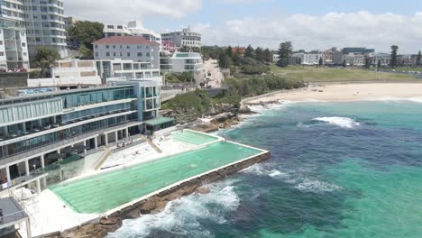 People-Swim-At-Swimming-Pool-Near-Bondi-Beach-In-Summer---Popular-Beach-In-Sydney,-New-South-Wales,-Australia