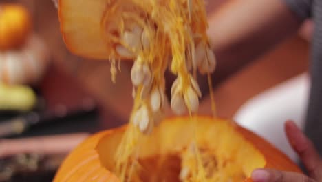 Someone-carving-pumpkin-for-halloween-season