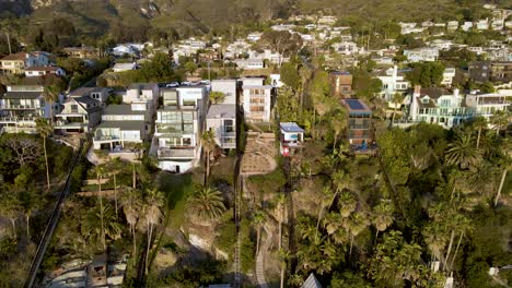 Aerial-view-of-real-estate-in-Laguna-Beach,-California,-wide-spinning-shot