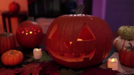 Tilt-of-Spooky-decoration-for-halloween-with-carved-pumpkins-and-candles