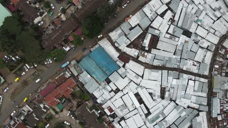 Birdseye-aerial-view,-Kibera-slum,-densely-poor-housing-neighborhood-of-Nairobi-Kenya