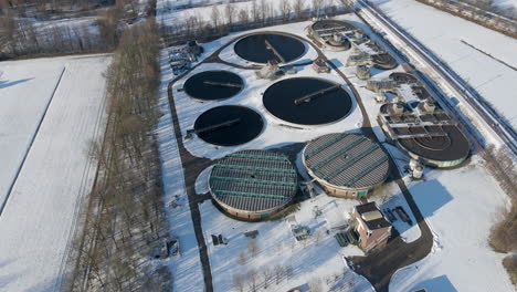 Aerial-overview-of-basins-at-sewage-water-treatment-plant-in-winter