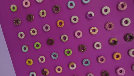 Rotating-shot-of-a-colorful-glazed-donut-wall