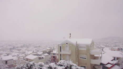 Rare-abnormal-Medea-blanket-covered-snowdrift-across-domestic-Greek-neighbourhood-city-landscape