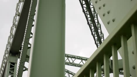 Industrial-steel-bridge-strong-girder-beam-support-framework-upward-looking-right-dolly