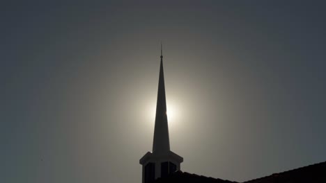Sun-Peeks-through-Silhouetted-Mormon-Church-Spire