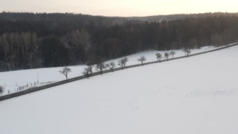 Aerial-Shot-Of-Beautiful-Winter-Landscape-Scene-During-Sunrise,-Czech-Republic-Covered-In-Snow