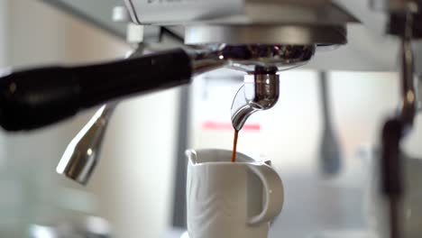 professional-espresso-machine-making-a-coffee,-backlit,-truck-right