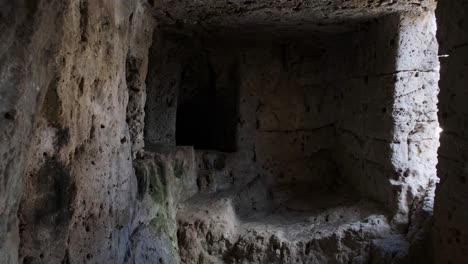 Exploring-ancient-ruins,-Roman-tombs-inside-a-necropolis