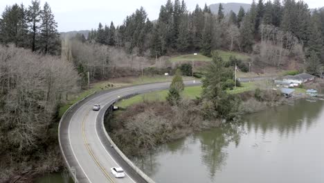 Cars-driving-on-Nehalem-river-bridge,-Oregon