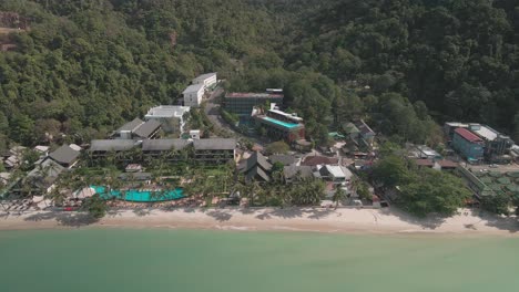 Aerial-panoramic-view-of-hotels-on-a-beach-on-a-tropical-Island-Thailand