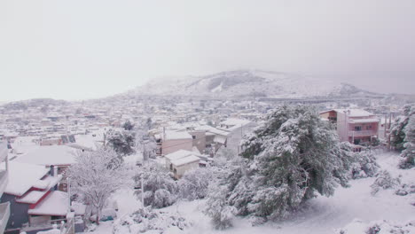 Rare-Medea-snow-covered-Mount-Lycabettus-winter-white-Athens-urban-suburb-skyline