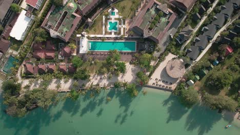 Rooftop-view-of-the-drone-from-the-coastal-beach-on-the-swimming-pool,-Swimming-pool-view-of-hotel-from-the-drone