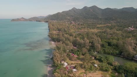 Aerial-view-of-coastline-and-beach,-tropical-mountains-and-ocean,-Koh-Chang