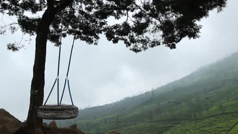 one-swing-atop-a-hill-that-moves-without-people