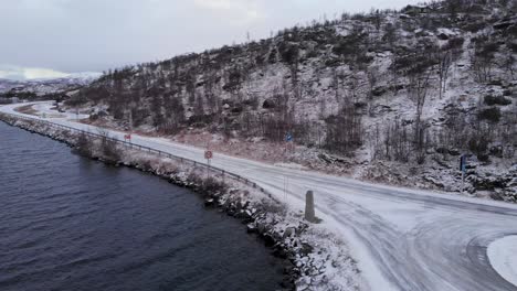 Frozen-landscape-at-Norway–Sweden-border-near-nordic-lake---Aerial-low-angle-shot