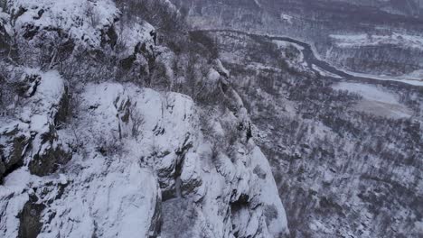 Inhospitable-frozen-mountain-range-environment-in-Swedish-Scandes---Aerial-Fly-over-shot