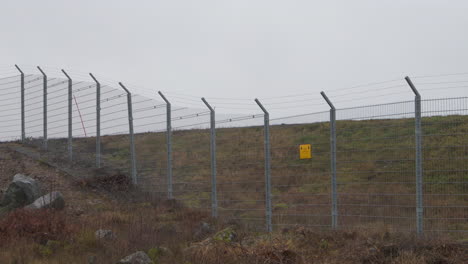 Slow-pan-of-the-security-fence-of-Arlanda-airport-in-Stockholm