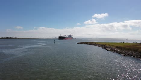 Merchant-ship-at-San-Jacinto-River-nearing-Morgan's-Point-in-LaPorte,-Texas