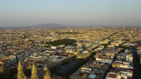 Backwards-Aerial-Reveal-Guadalajara-Cathedral,-Teatro-Degollado