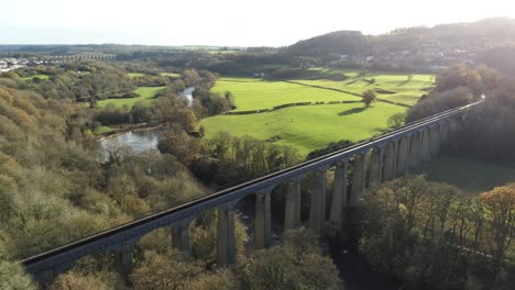 Old-Welsh-Pontcysyllte-Aqueduct-waterway-aerial-view-rural-Autumn-woodlands-valley-wide-orbit-right