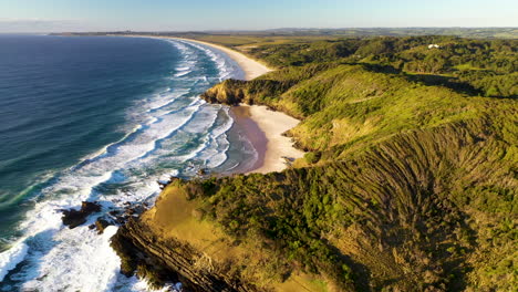 Cinematic-rotating-drone-shot-of-crashing-waves-at-Broken-Head-beach-near-Byron-Bay