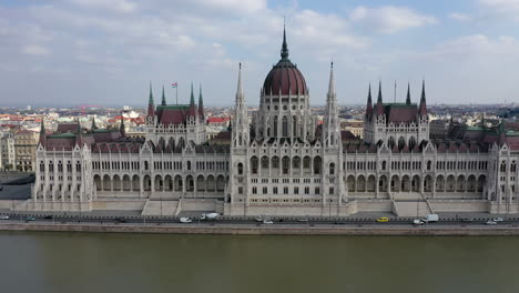 aerial-view-Parliament-building-and-Danube-river-in-Budapest,-cloudy-day