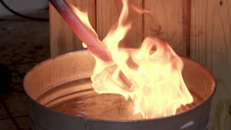Blacksmith-Dowsing-Flaming-Red-Hot-Iron