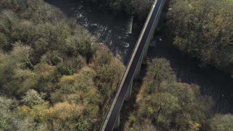 Old-Welsh-Pontcysyllte-Aqueduct-waterway-aerial-view-rural-Autumn-woodlands-valley-birdseye-over-fly