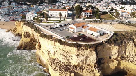 Aerial-4K-drone-footage-revealing-the-coastline-resort-city-of-Carvoeiro,-Portugal
