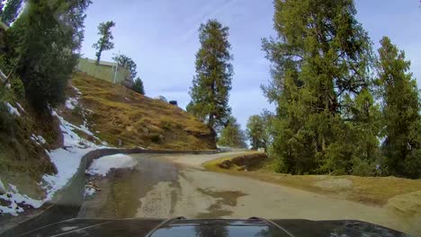 4x4-SUV-driving-through-narrow,-curved-and-steep-mountainous-roads-during-winters