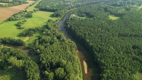 Aerial-reveal
shot-of-the-river-Morava-on-the-border-of-Czech-Republic,-Slovak-Republic-and-Austria