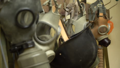 Old-vintage-gas-masks-hanging-on-a-wall