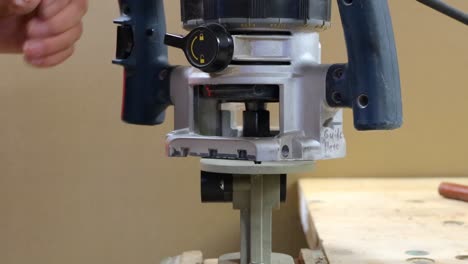 Inspecting-a-wooden-dowel-and-making-bolt-thread-on-dowel-using-electric-router-and-jig