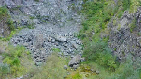 Aerial-approaching-rocks-at-bottom-of-valley